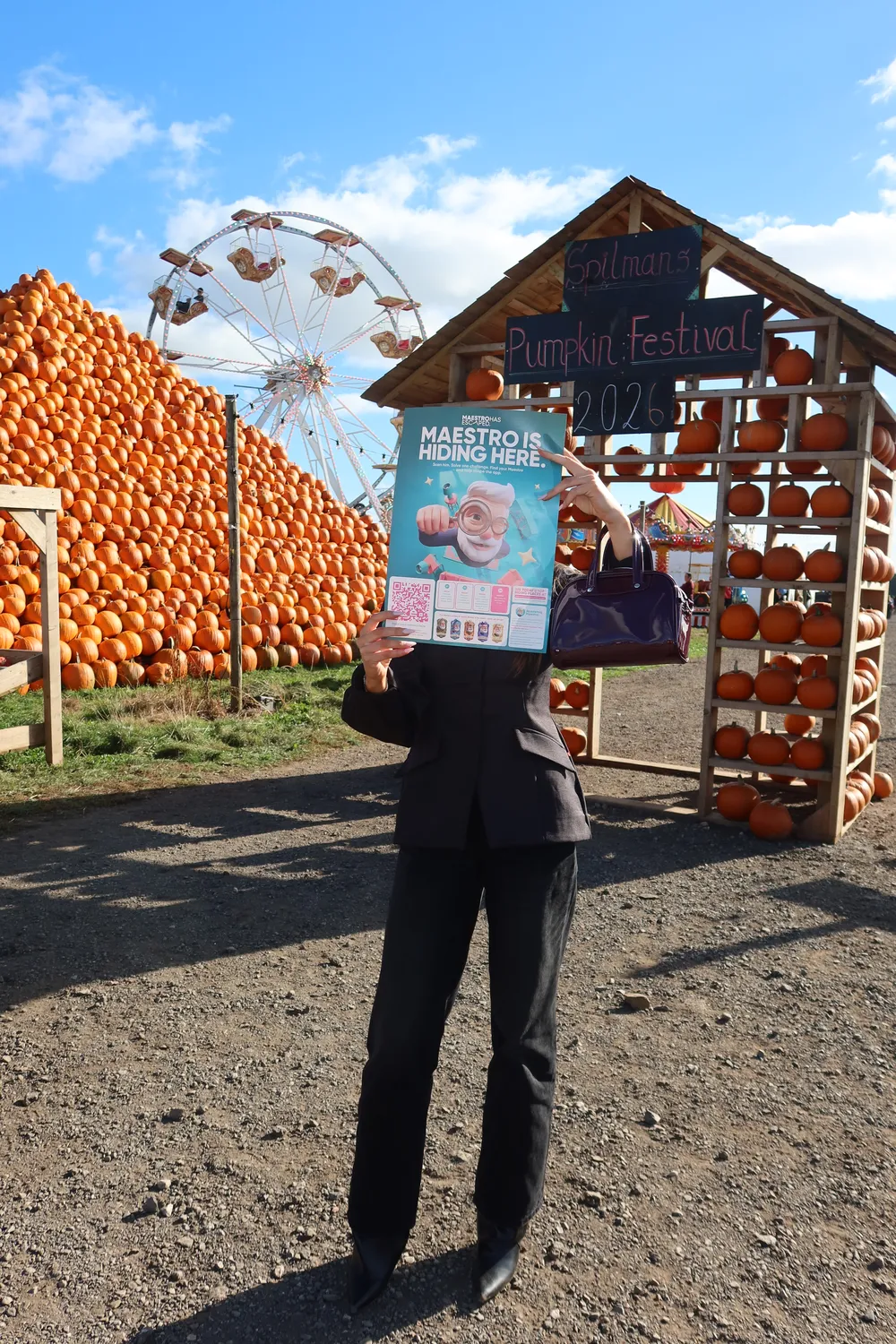 Find Maestro poster in front of pumpkins at Spilmans Pumpkin Festival 2026